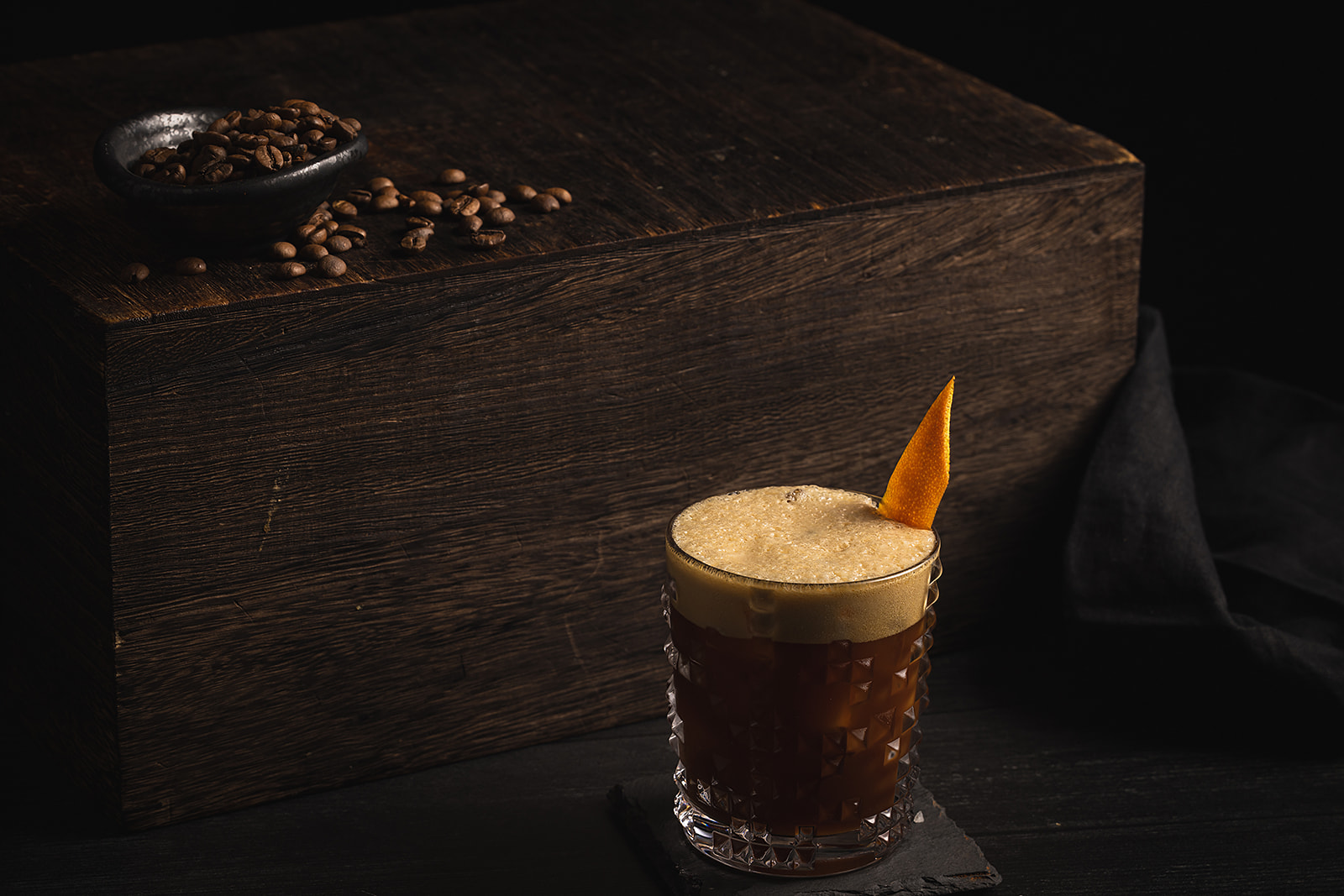carajillo cocktail against a wood background