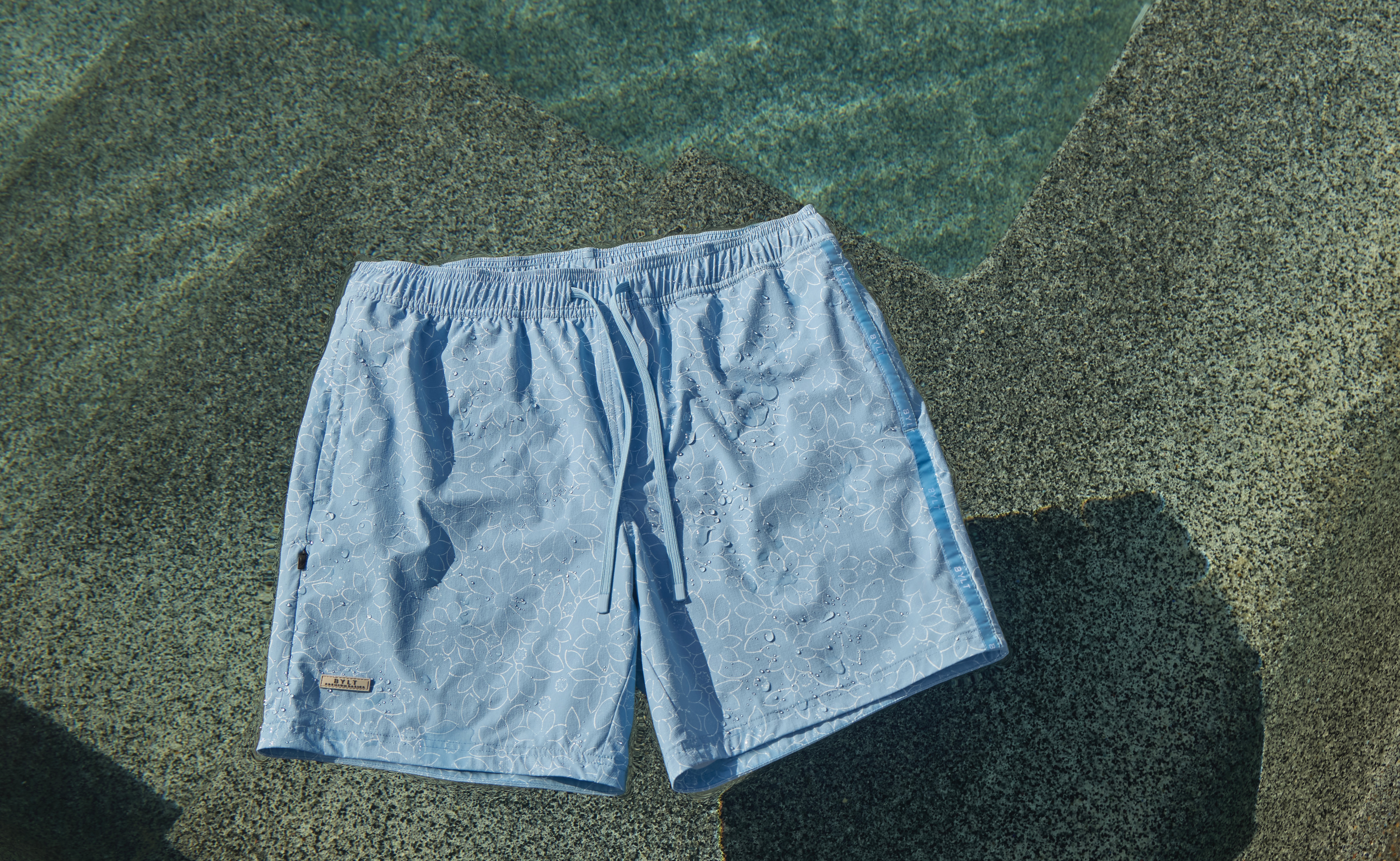 blue shorts floating in a pool