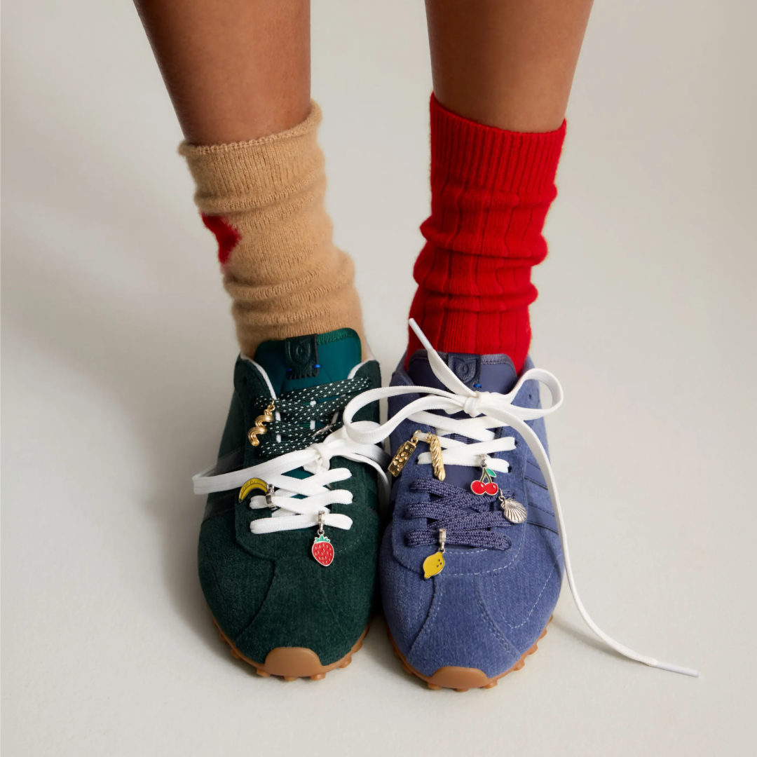 closeup of the ivy sneaker with charms hanging off the laces