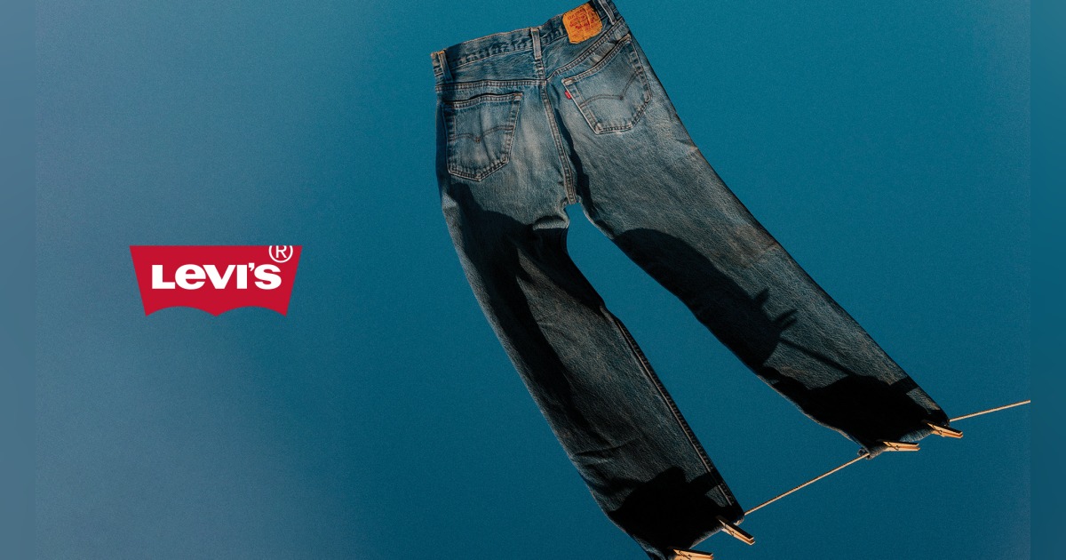 levis logo with a pair of jeans hanging from a clothesline 