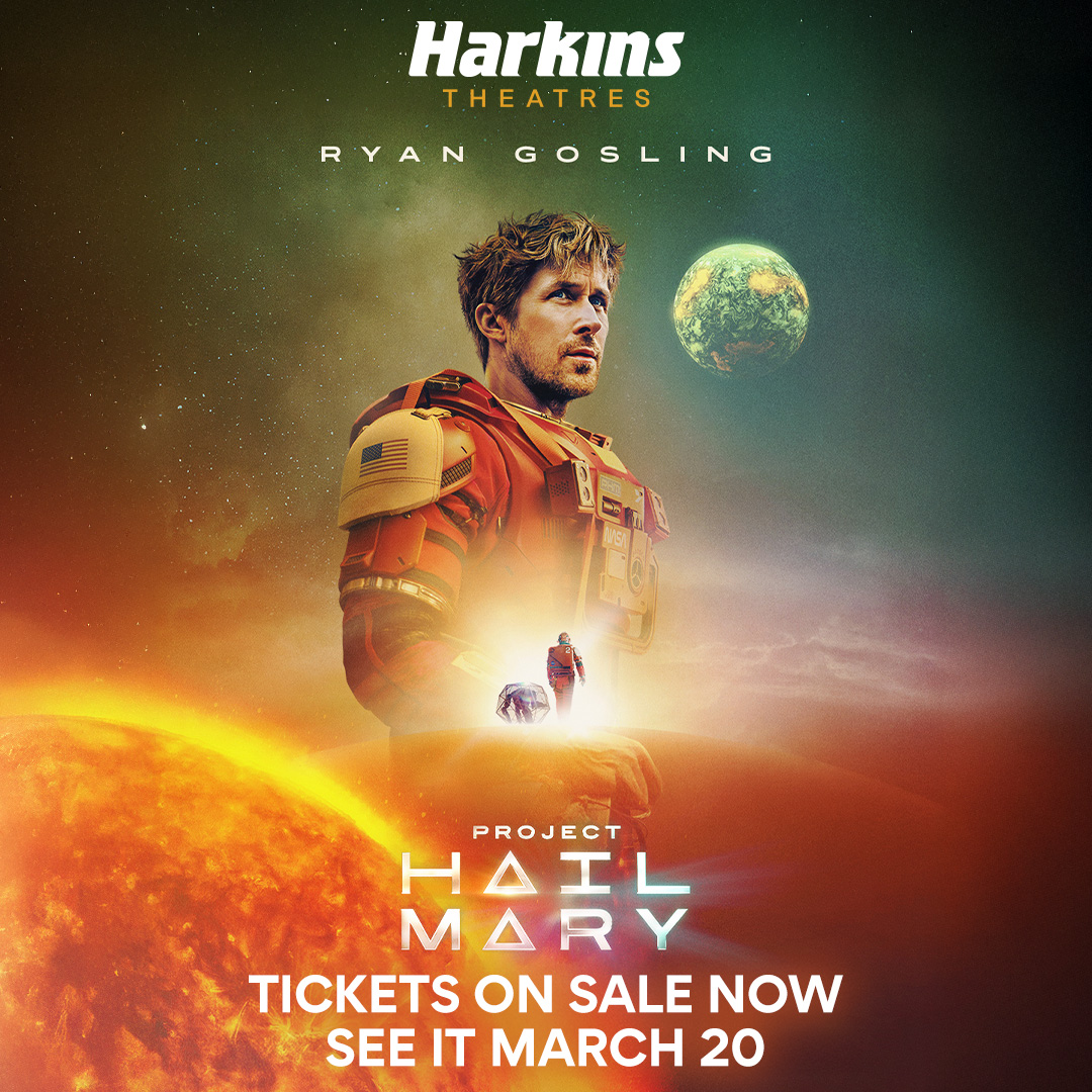 image shows Ryan Gosling with plants behid him