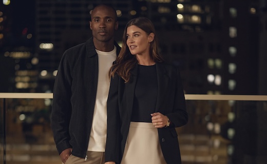 man and woman posing in nice clothes
