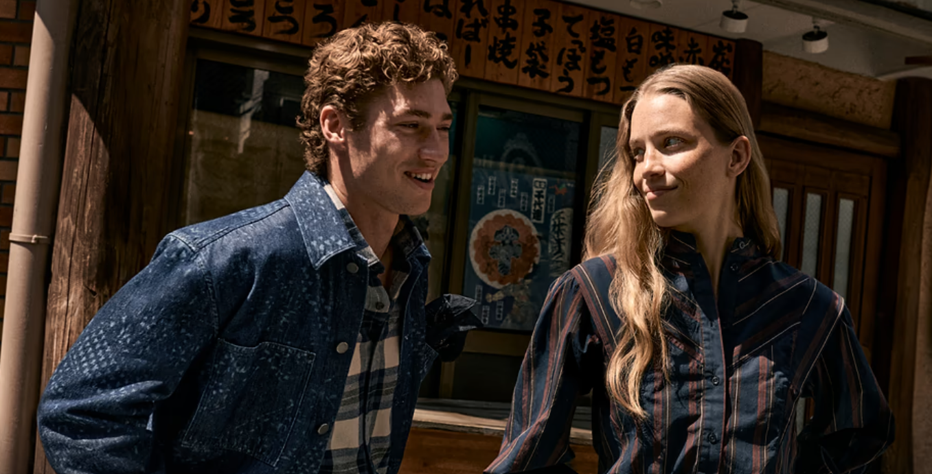 male and female model laughing at each other 