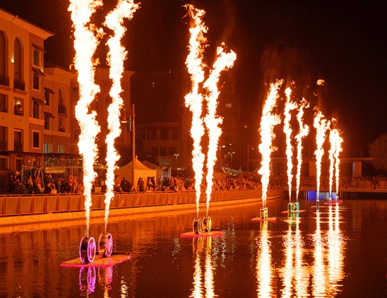 image of waterfront with fire display as art