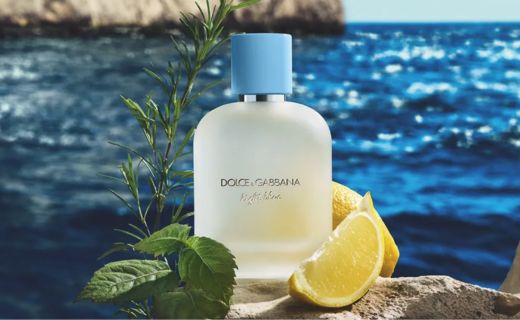 dolce and gabbana perfume against an ocean background 