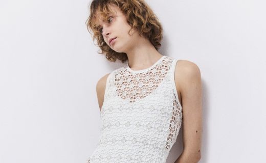 model in white dress posing 