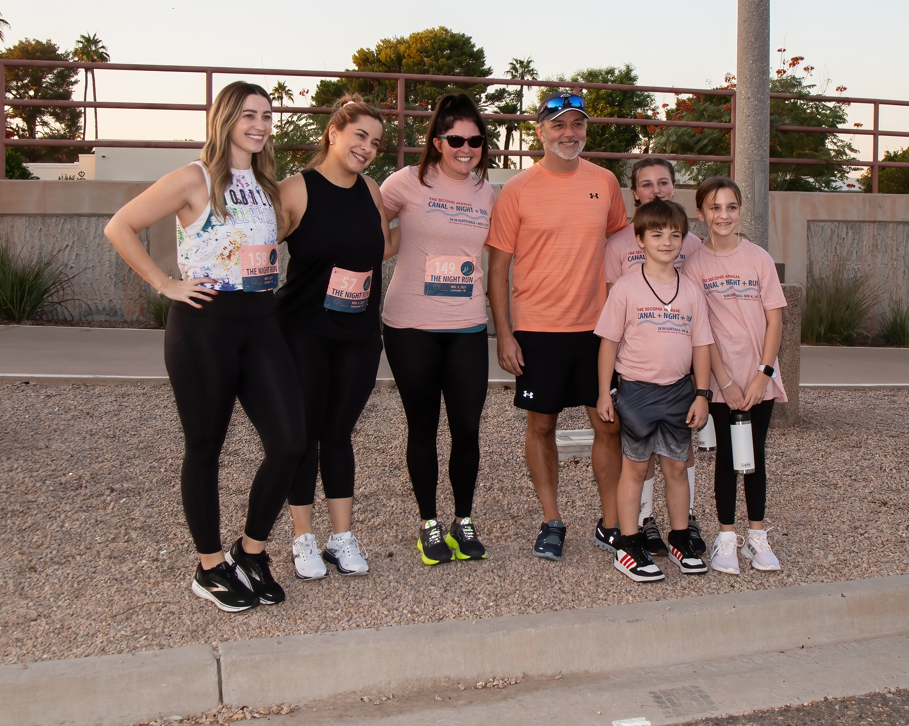 photo of group smiling in their race bibs