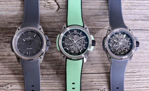 3 watches lined up against a wooden background