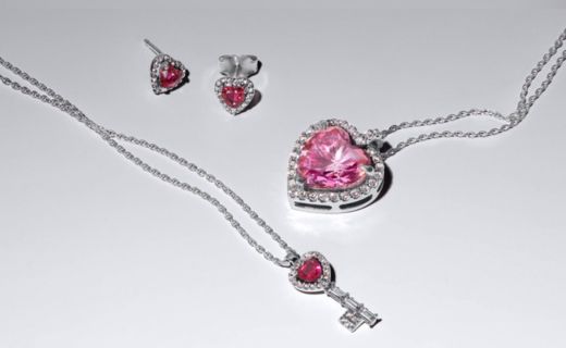 pink and red jeweled necklaces and earrings display