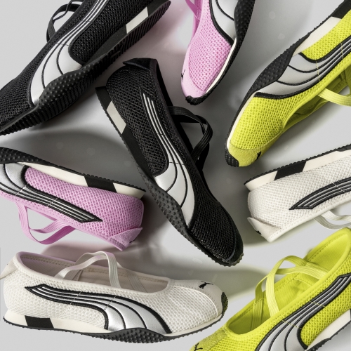 black, white, yellow, and pink sneakers against a white backdrop 