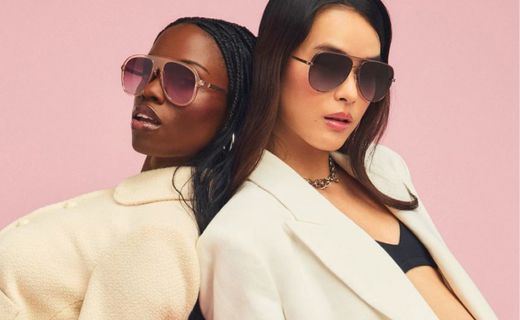 two girls posing back to back