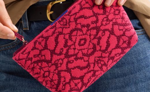 closeup image of red and pink pouch being unzipped