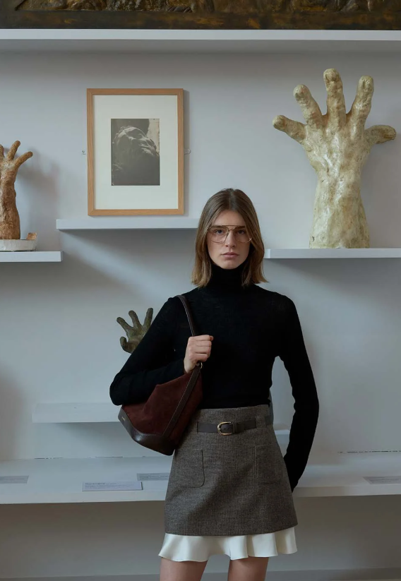 model wearing sandro outfit posing 