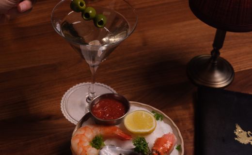 martini with chilled shrimp on a table 