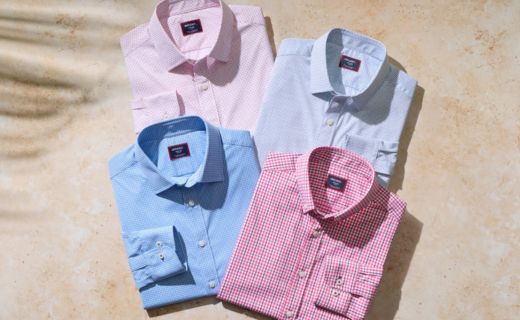 pastel colored shirts against a beach background 