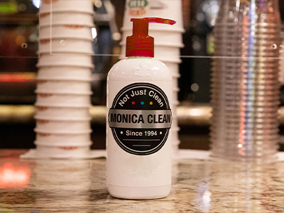 Bottle of hand sanitizer that says Monica Clean.
