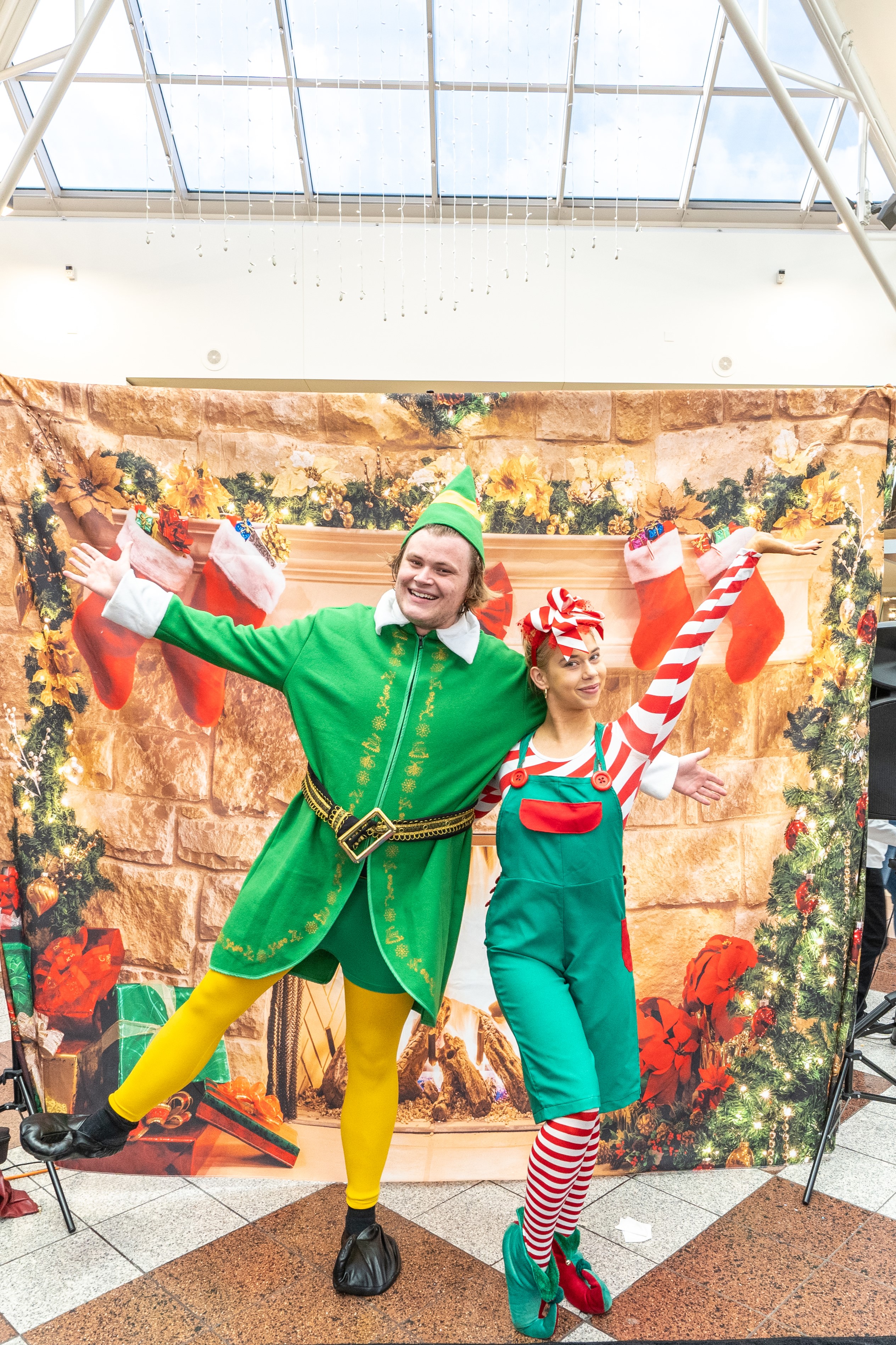Two of santa's helpers dressed as elves. 