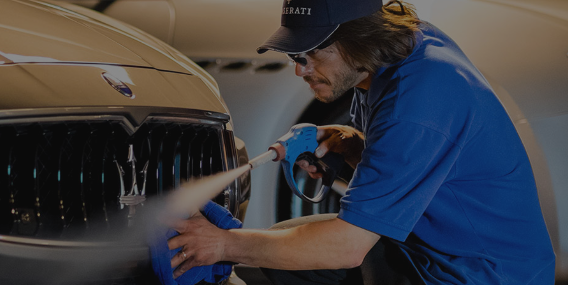 Man power washing a car