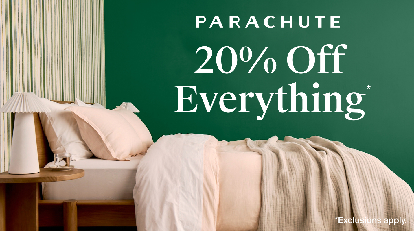 Side view of a bed with a green wall. Text reads 'Parachute 20% off everything* Exclusions apply.'
