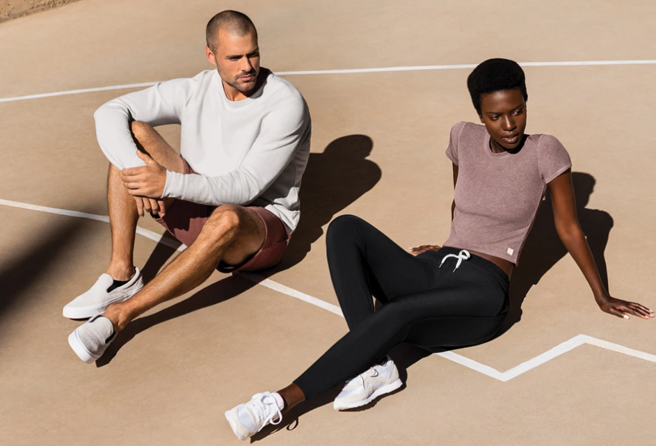 Man and woman lounging on ground