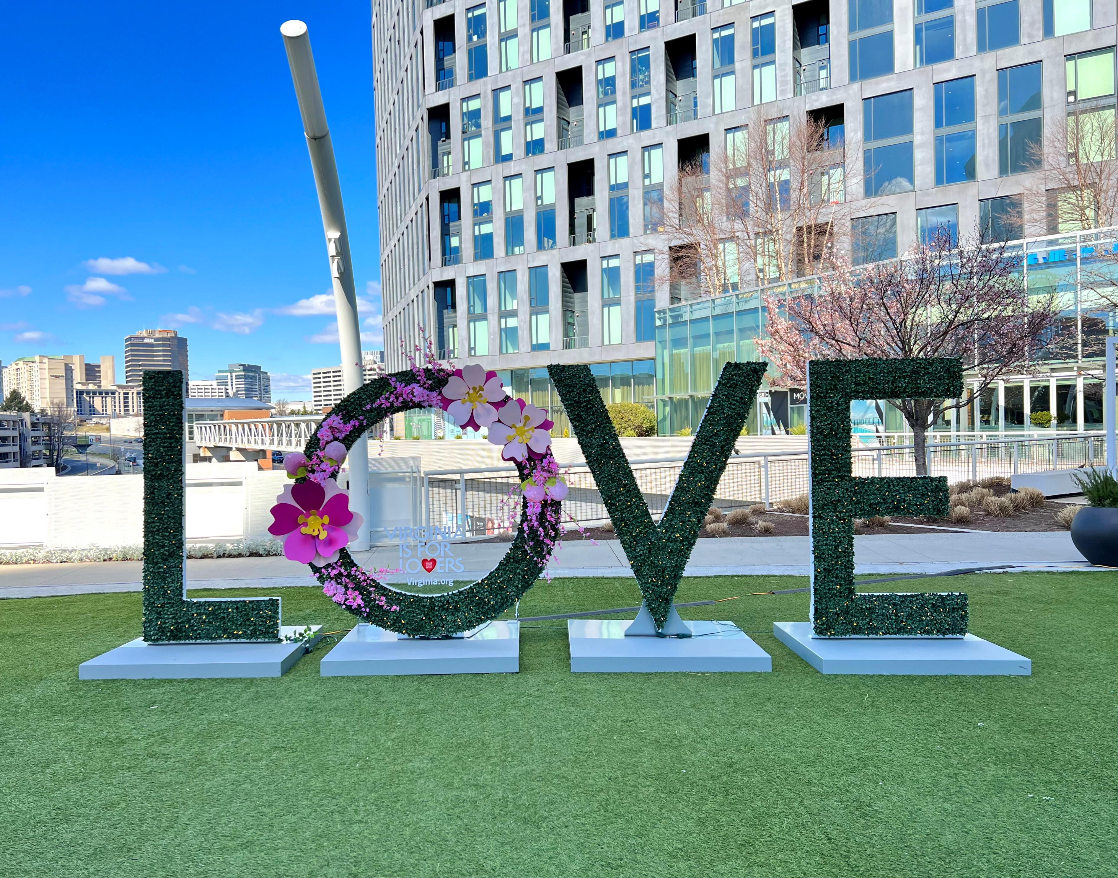 L-O-V-E sign with a cherry blossom floral decorated "O"