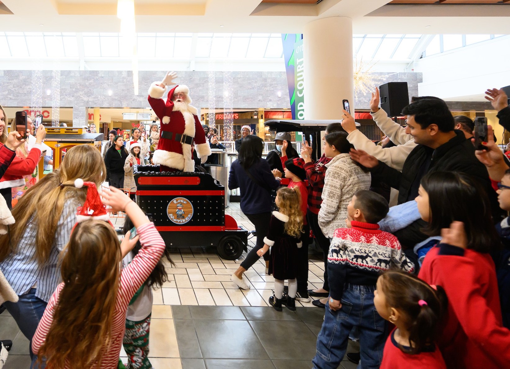 Santa making a grand entrance on a train 