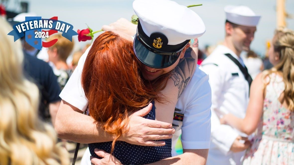 man in military uniform hugging a loved one 