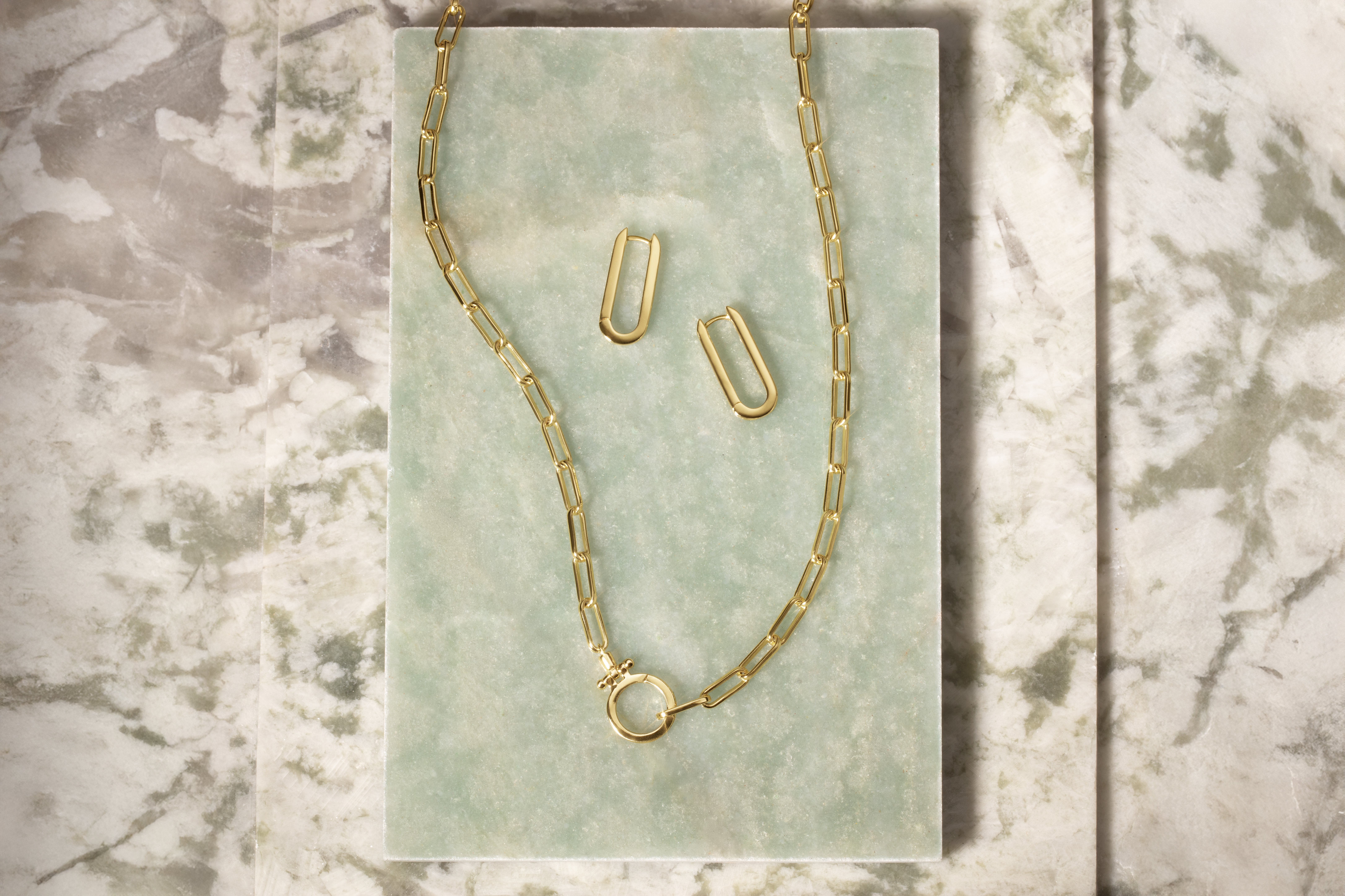A gold necklace and earrings from Gorjana 