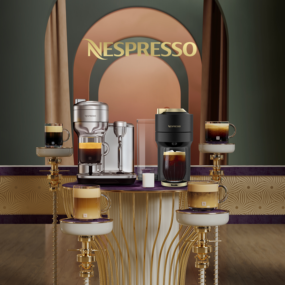 A coffee and espresso maching in front of a sign that says Nespresso