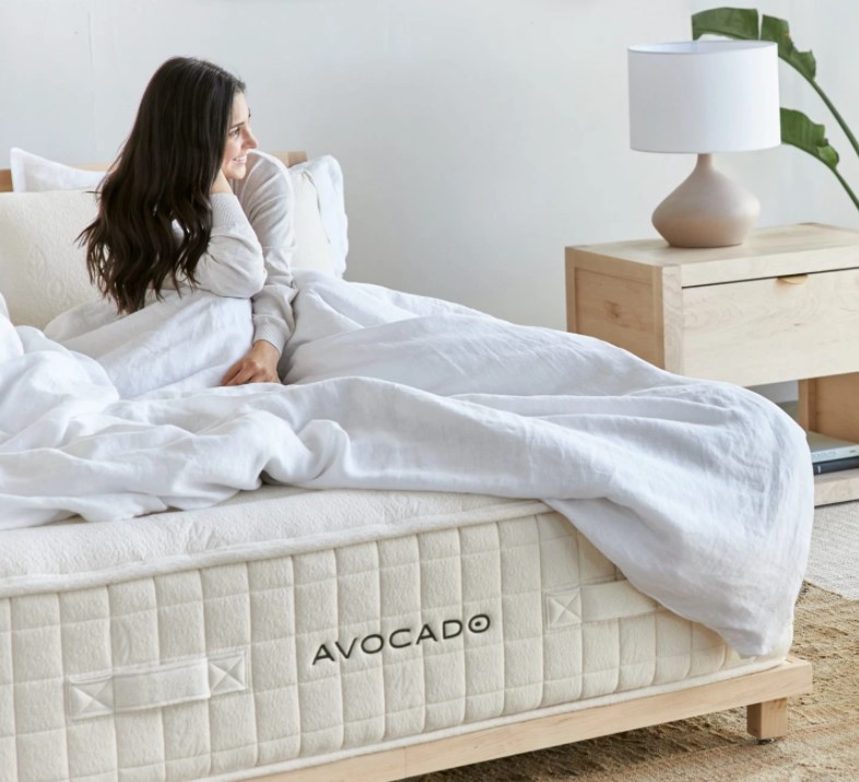 Woman lying on an Avocado mattress