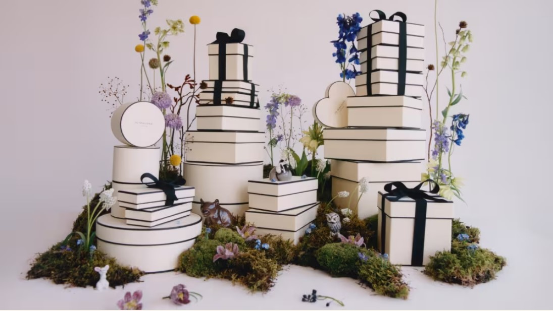 Wrapped Jo Malone ivory and black boxes with spring floral accents