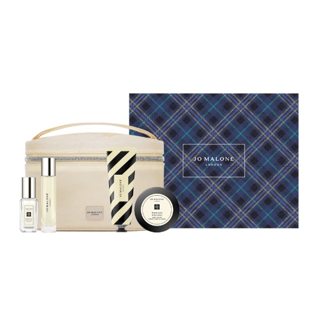Four mini Jo Malone products displayed in front of a cosmetic bag