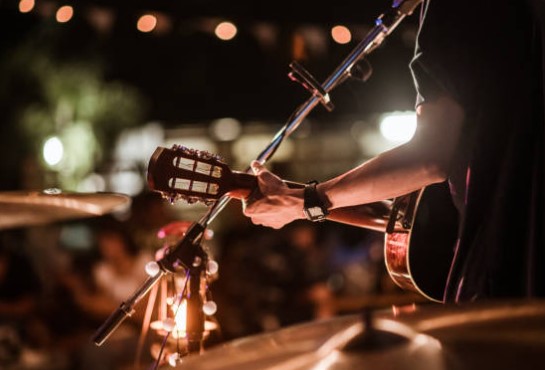 A man playing a guitar