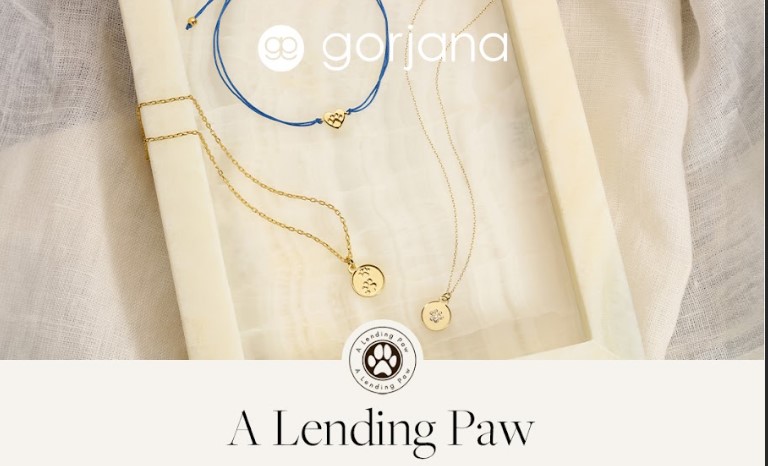 Necklaces and a bracelet with paw prints from Gorjana promoting their promotion with A Lending Paw
