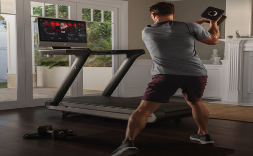 Image of man exercising near Peloton bike