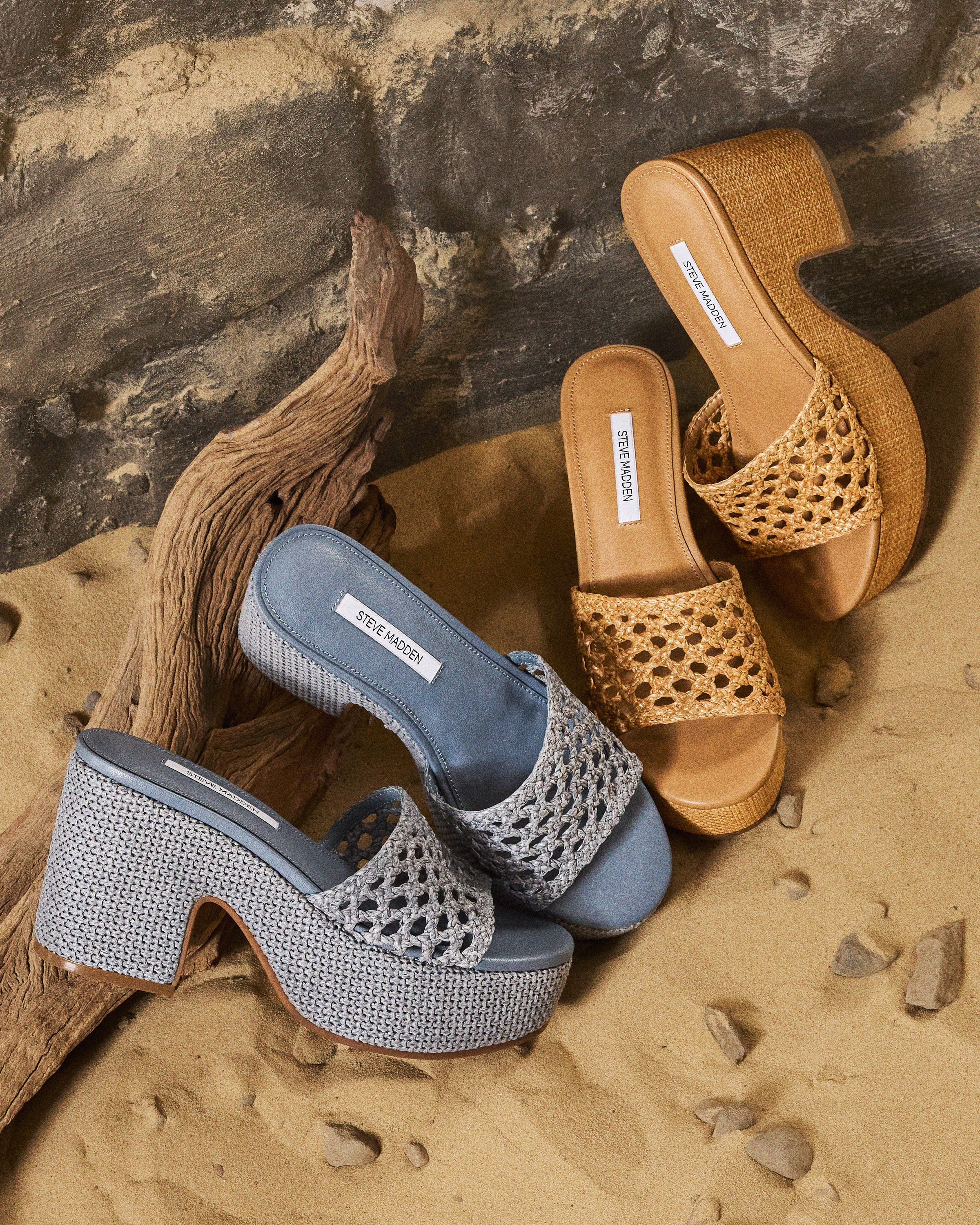 Two pairs of Steve Madden platform sandals on the sand