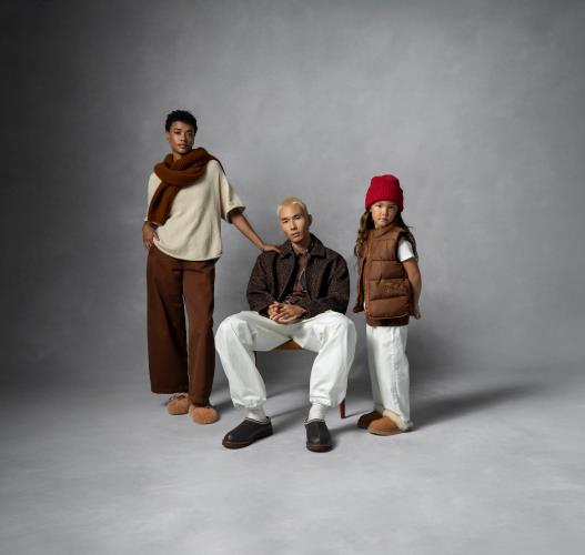A woman, young man and little girl all wearing Uggs