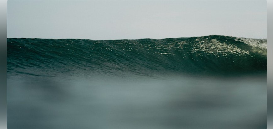 An ocean wave curling