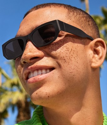 A man wearing a pair of Warby Parker sunglasses