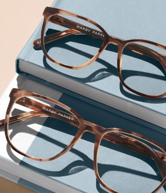 Warby Parker's Eyeglasses resting on books