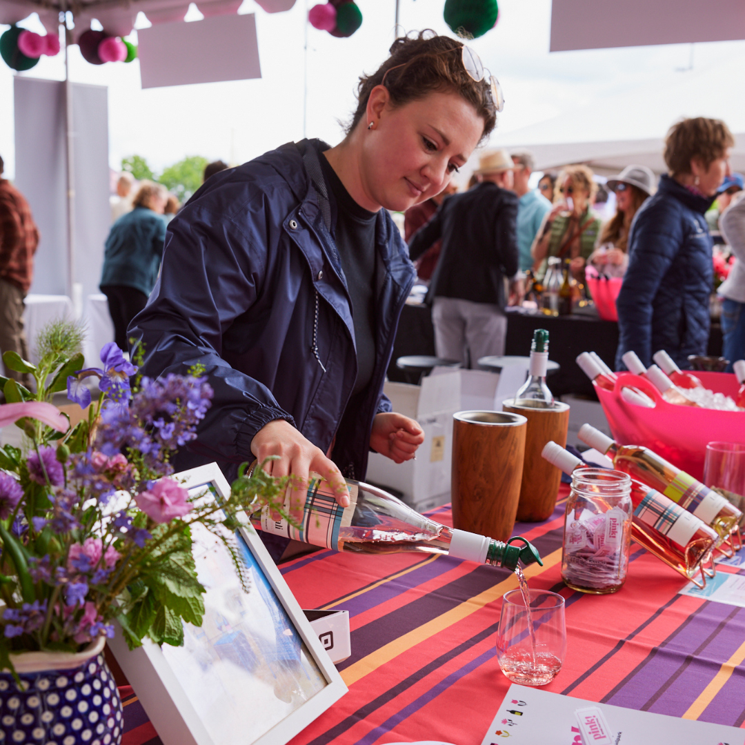 woman pouring a glass of rose