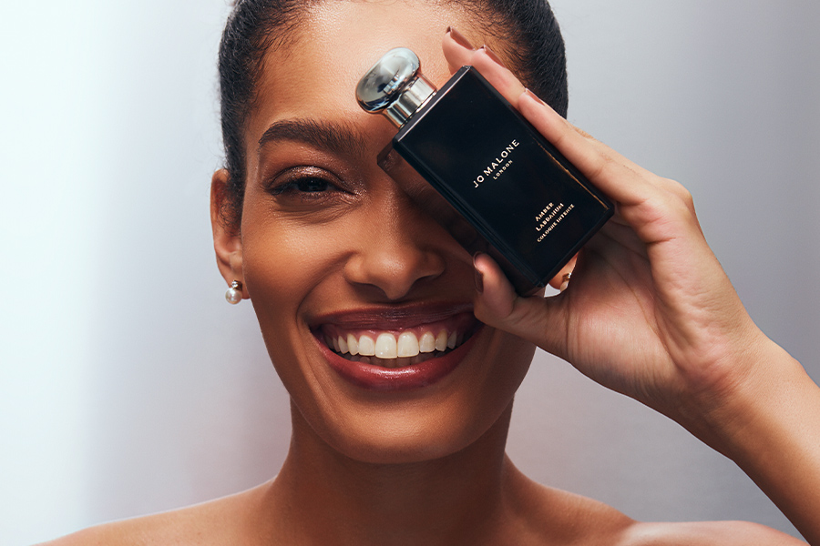 a model holding a Jo Malone bottle