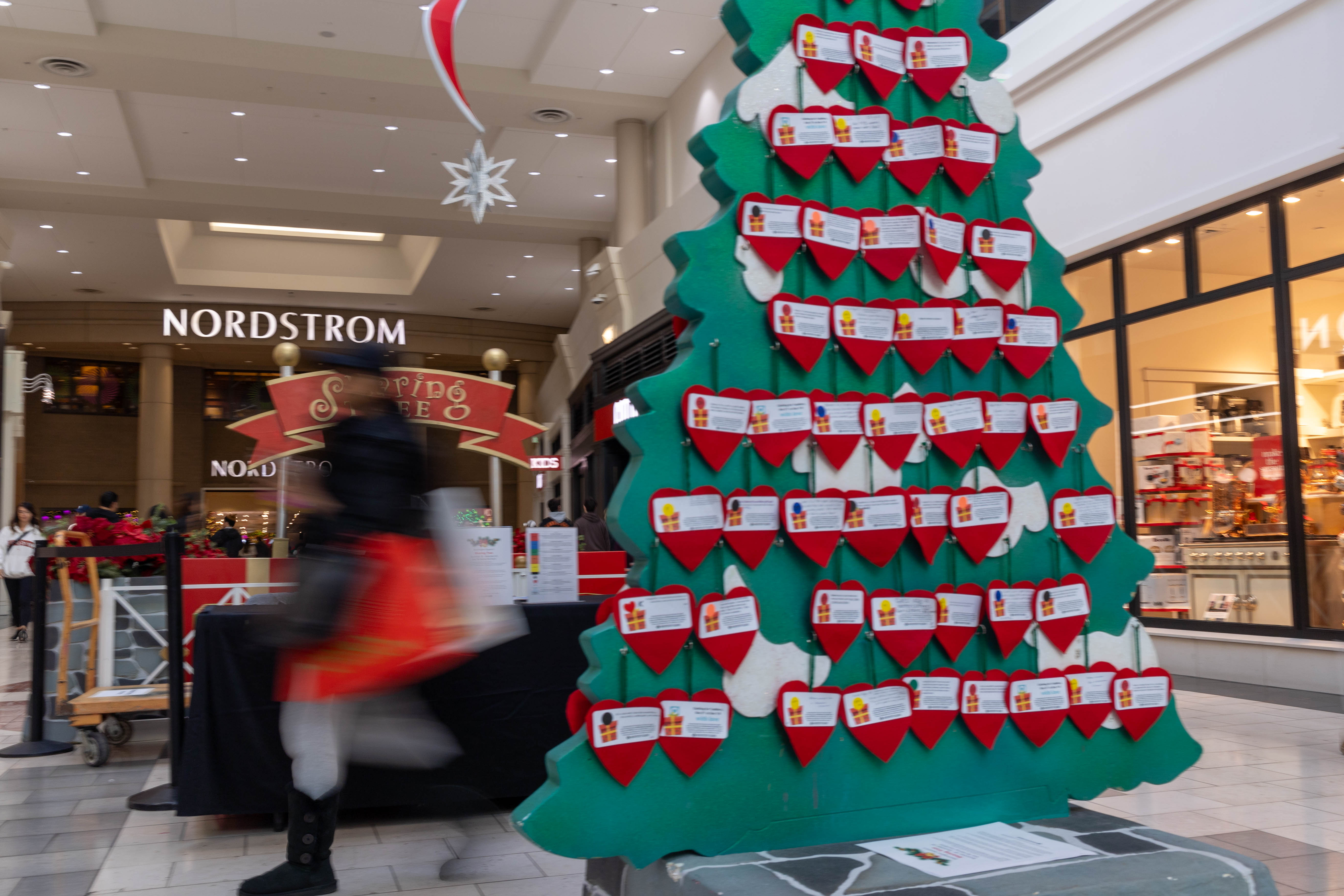 A picture of the Sharing Tree next to Williams Sonoma and Nordstrom