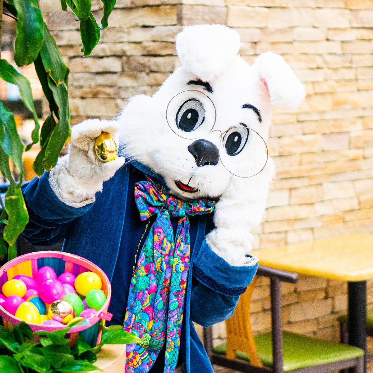 The Easter Bunny holding plastic Easter eggs