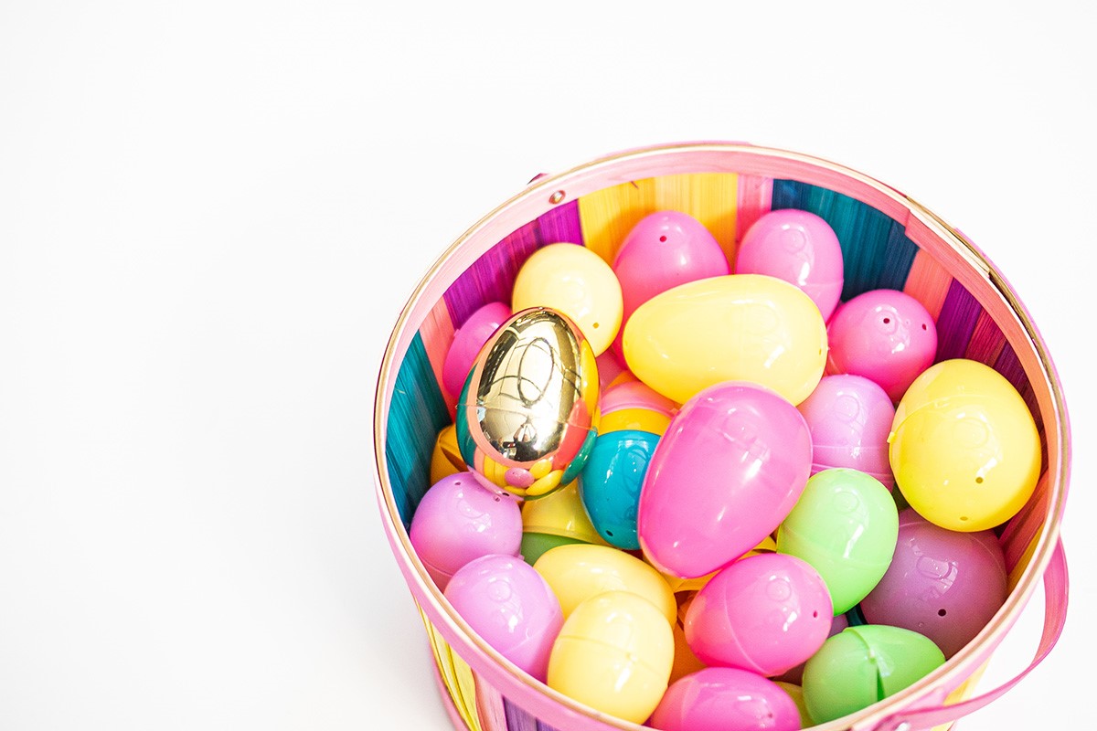 A wicker basket of plastic Easter Eggs