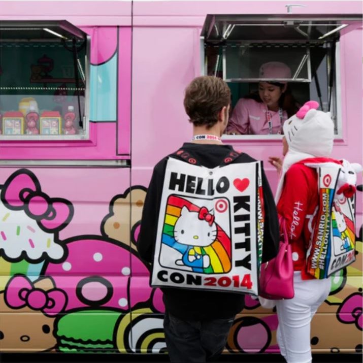 an image of the Hello Kitty Cafe truck and customers at the window ordering