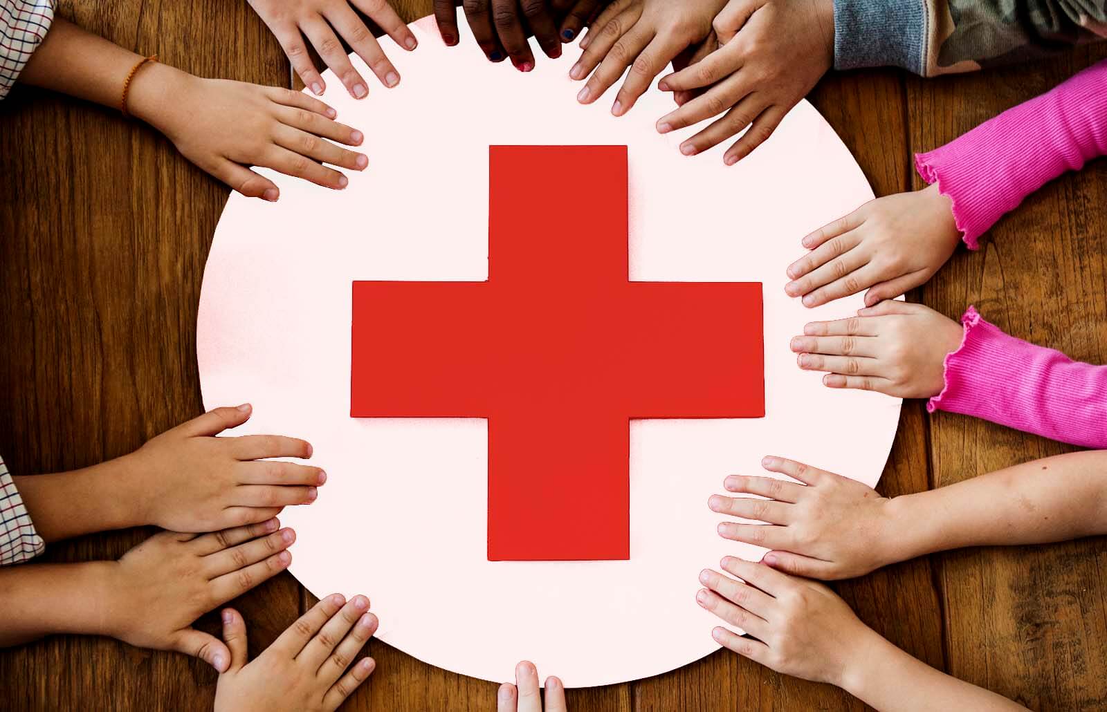 American Red Cross logo with caring hands 