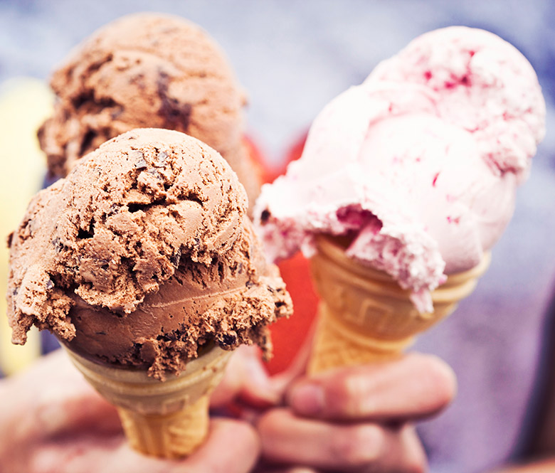 Hands holding ice cream cones