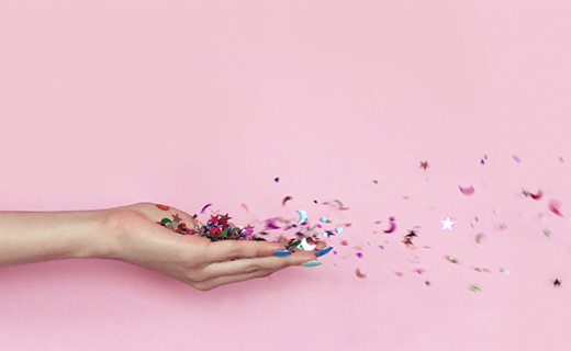 Hand with confetti 