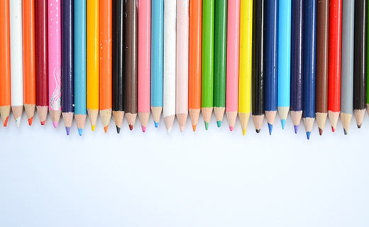 different colored pencils in a row